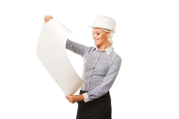 Young female construction specialist looking on blueprints — Stock Photo, Image