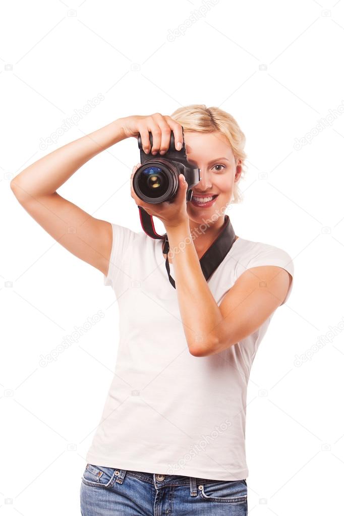 Happy smiling woman photographer shooting, isolated on white background