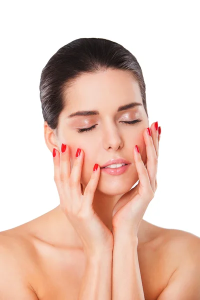 Close-up portrait of young beautiful brunette woman touching her face with manicured hand — Stock Photo, Image