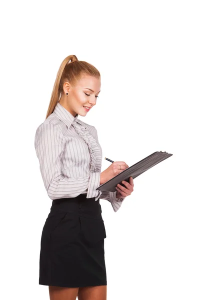 Happy smiling cheerful young businesswoman writing on clipboard — Stock Photo, Image