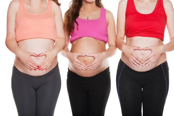 Groep van zwangere vrouwen raken hun buik — Stockfoto