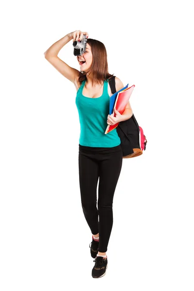 Hermosa joven adolescente estudiante posando con cuadernos y cámara — Foto de Stock