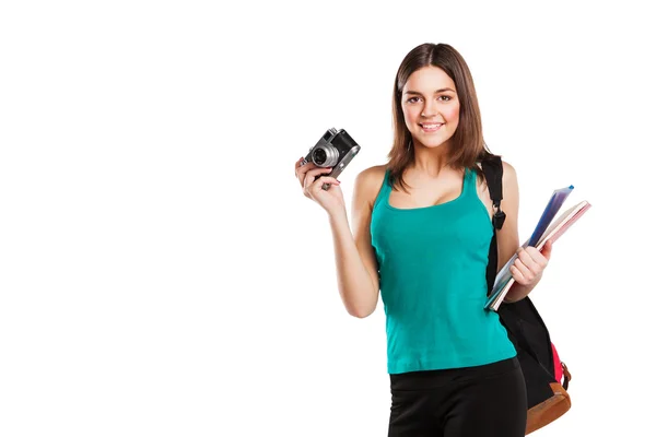 Beautiful young female student posing with notebooks and camera — Stock Photo, Image