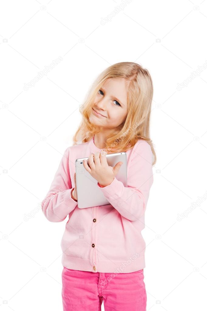 Happy little girl using tablet computer