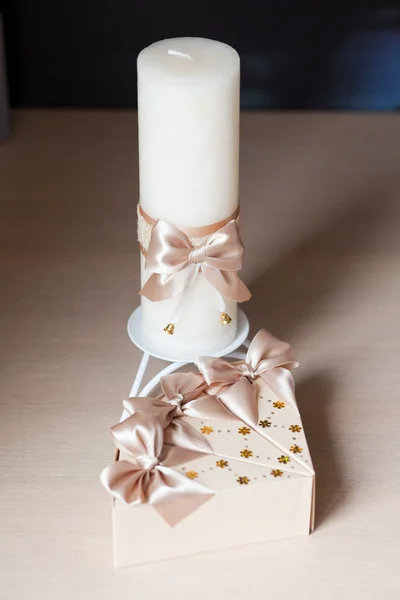 Box-shaped piece of cake and candle — Stock Photo, Image