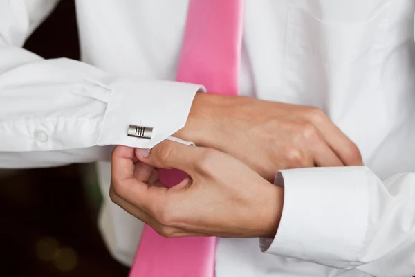 Close up of a hand man how weares white shirt and cufflink — стоковое фото