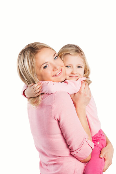 Portrait of happy embracing mother and daughter