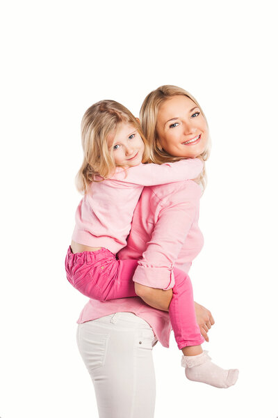 Portrait of happy embracing mother and daughter