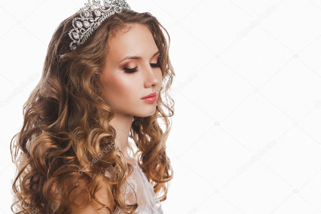 Portrait of young beautiful bride with stylish make-up and hairdo, isolated on white background