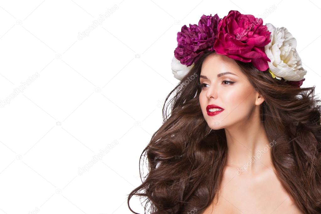 beautiful brunette young woman with wreath of peonies flowers studio shot 