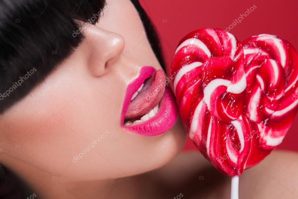 Portrait Of Sexy Lips And Tongue Licking Lollipop On Red Background Stock Photo Portrait Of Sexy Lips And Tongue Licking Lollipop On Red Background Stock Photo