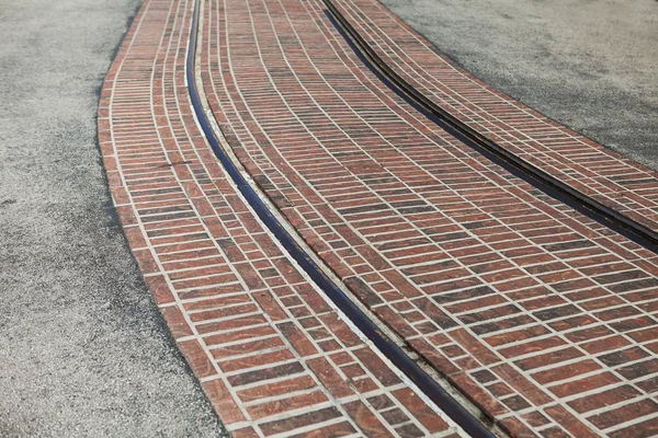 Bending tram rails on the street a sunny summer day — Stock Photo, Image