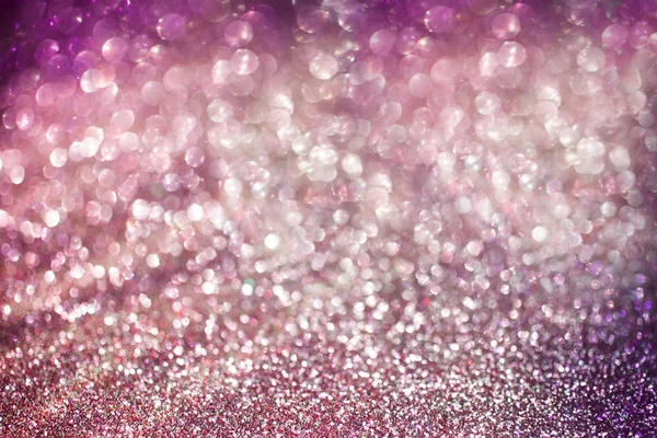 Lights purple and pink defocused bokeh background.