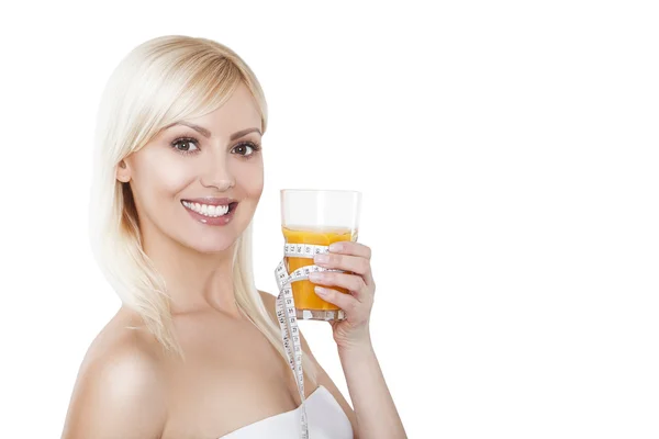 Young woman with glass of orange juice. Female model happy smile. — Stock Photo, Image