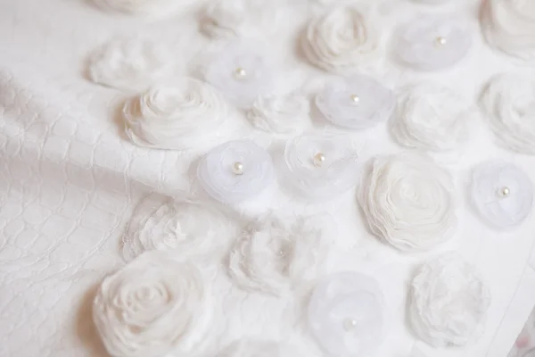 Textilní pozadí svatební s pastelových růží — Stock fotografie