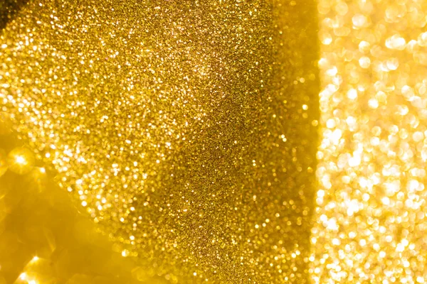 Złoty brokat Boże Narodzenie streszczenie tło. Błyszczący złoty światła — Zdjęcie stockowe