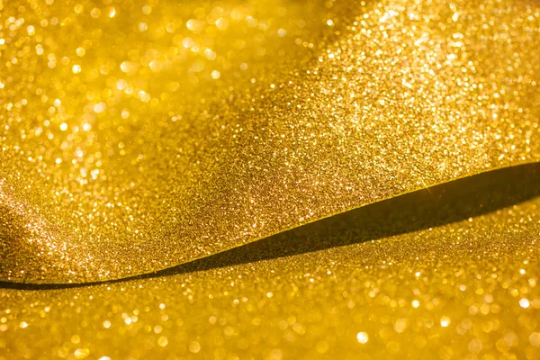 Goldener Glanz Weihnachten abstrakten Hintergrund. Goldglänzende Lichter — Stockfoto