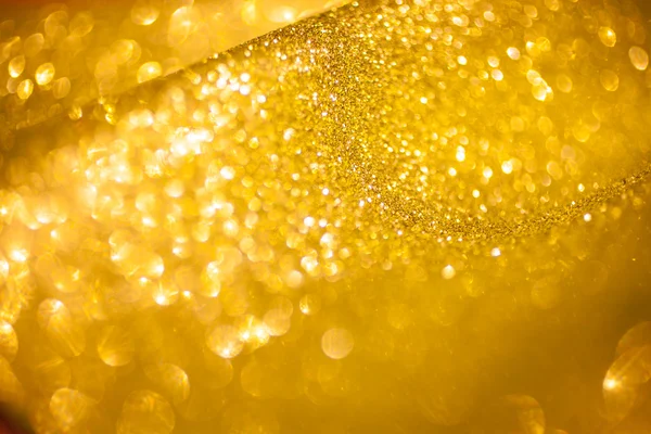 Fond abstrait de Noël aux paillettes dorées. Lumières dorées brillantes — Photo