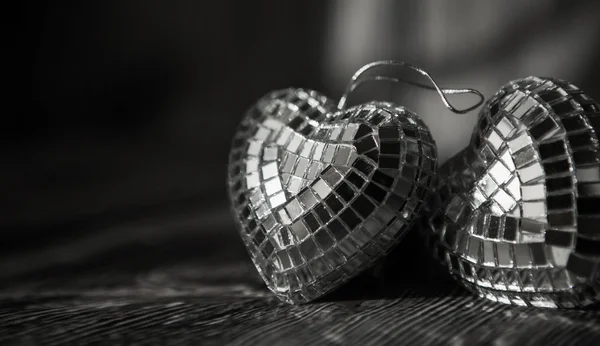 Shiny Valentine hearts on old wooden background — Stock Photo, Image