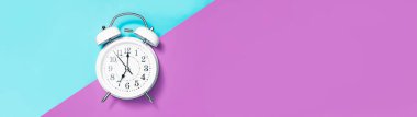 Banner white clock alarm in vintage style showing seven o'clock with copy space. clipart