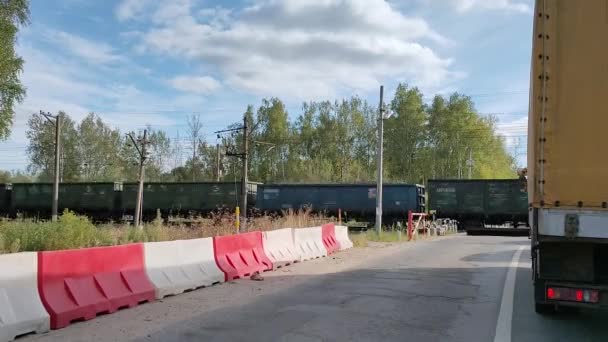 View of a moving train on the railroad and a lorry. — Stock Video