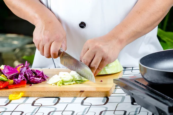 Chef cutting tomato — Stock Photo, Image