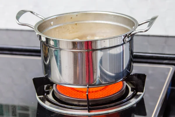 Pot on stove — Stock Photo, Image
