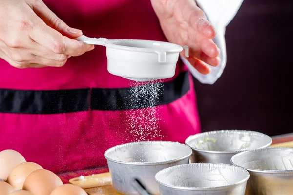 Chef sifting flour — Stock Photo, Image