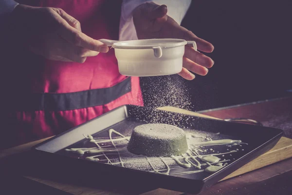 Chef sifting flour — Stock Photo, Image