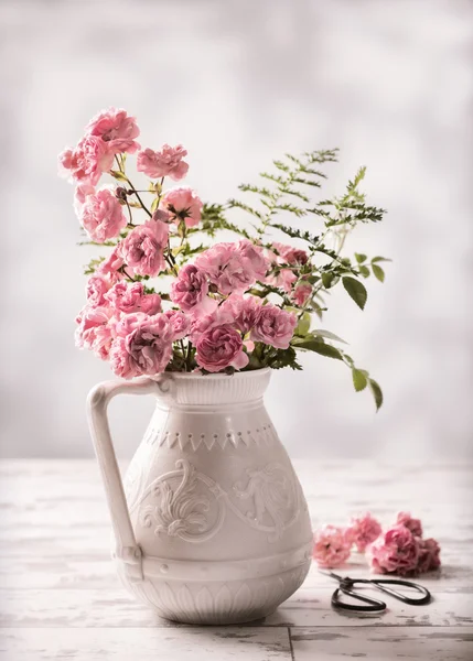 Pink Roses In Antique Jug — Stock Photo, Image