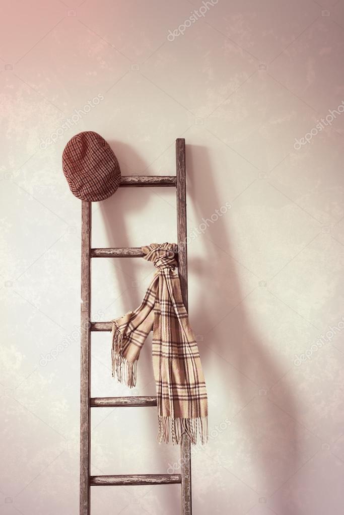 Flat Cap & Scarf On Rustic Ladder