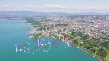 Lozan, İsviçre. Şehrin merkez kısmının üzerinde uçuş. Cenevre Gölü kıyısında. 4K