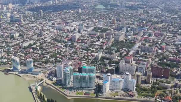 Krasnodar, Russia. New residential buildings on the Kubanskaya embankment. The Kuban River. Flight over the city in summer. 4K — Stock Video