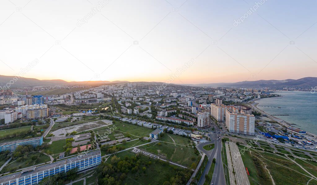 Novorossiysk, Russia. The central part of the city. Port in Novorossiysk Bay. Sunset. Aerial view