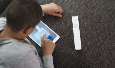 kid playing with ipad tablet