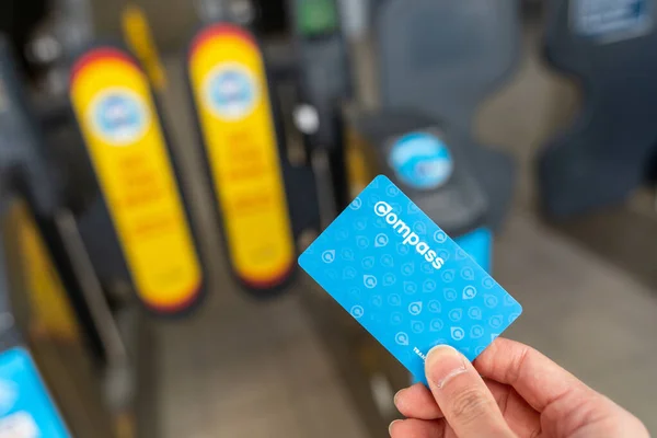 Richmond, British Columbia, Canada - MAR 11 2021 : Using Compass Card to enter the fare pay zone exit gate of Richmond-Brighouse SkyTrain Station. — Stock Photo, Image