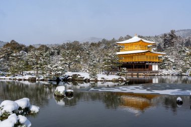 Snowy Kinkaku-ji Temple in winter. Famous tourist attraction in Kyoto, Japan. The Golden Pavilion, Kinkakuji, rokuon-ji, rokuon-ji. Snow landscape.