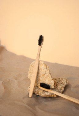 Composition of natural details and a bamboo toothbrush on beige background. Zero watse concept. clipart
