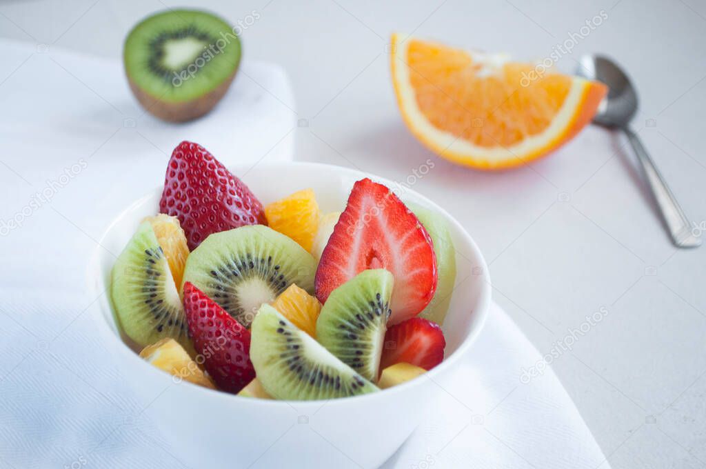 Fresh delicious fruit salad with strawberries and kiwi.