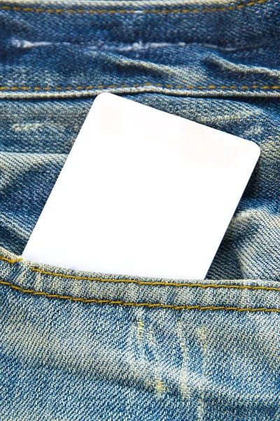 Precio de etiqueta de papel en blanco en azul jean —  Fotos de Stock