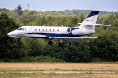 Cessna 680 Citation Sovereign corporate business jet arriving at Eindhoven Airport. The Netherlands - June 29, 2019 clipart