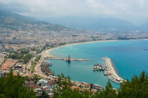 The breathtaking landscape of forest and sea harbor on the shores of the Mediterranean Sea in Turkey, Alanya.