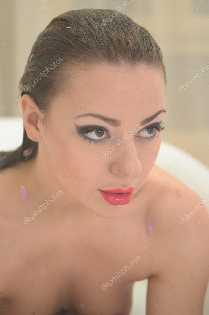 Naked woman taking bath — Stock Photo © santiss #61799475