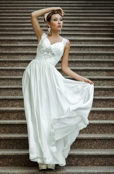 Brunette woman in white wedding dress — Stock Photo, Image