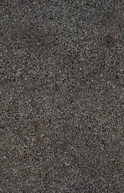 Gri çakıllı, pürüzsüz bir duvar.