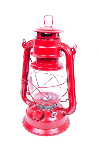 Fehér alapon piros petróleumlámpa — Stock Fotó