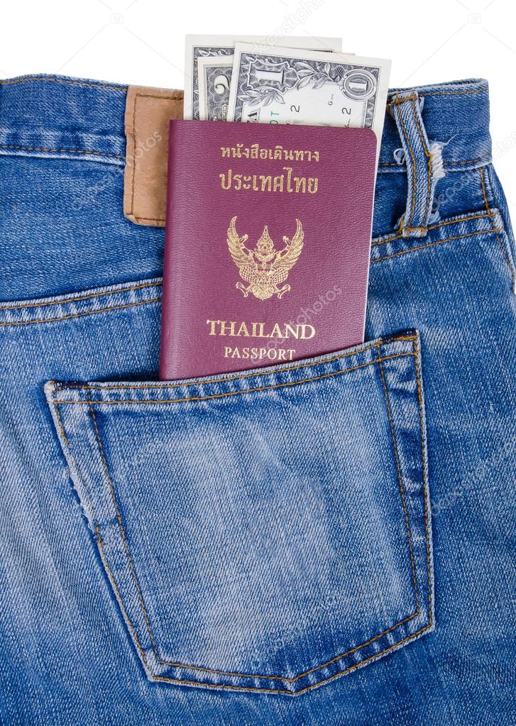 Thailand passport and dollar bills in the back jeans pocket