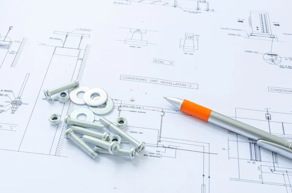 Орехи и болты крупным планом над архитектурой — стоковое фото