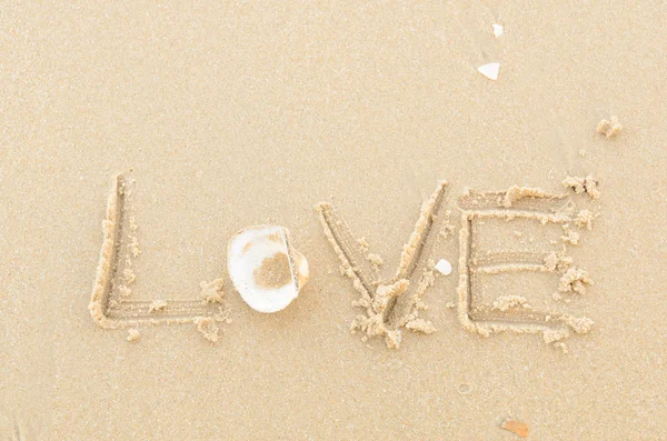 Love message written in sand — Stock Photo, Image