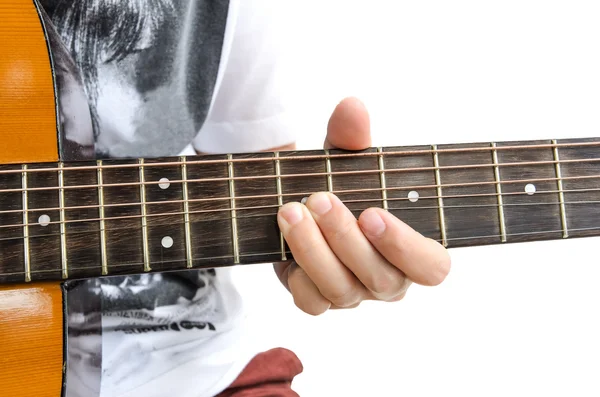 Tocando en la guitarra acústica Imágenes de stock libres de derechos